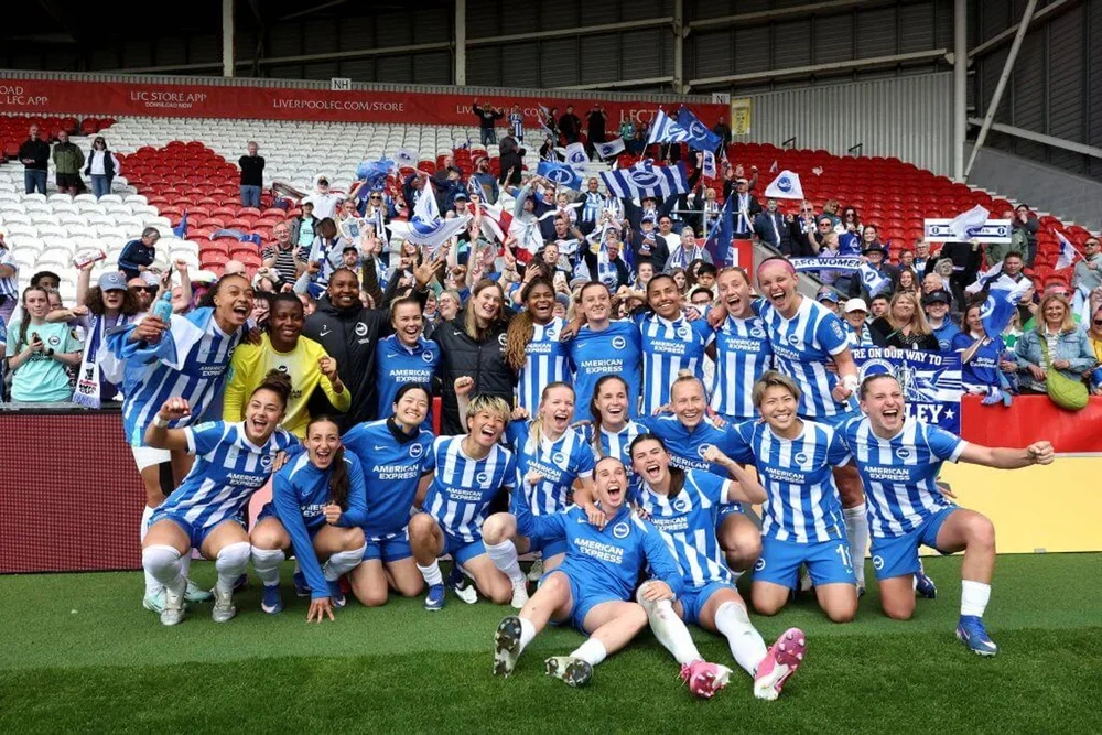 Brighton & Hove Albion's players celebrate after reaching the Women's FA Cup final for the first time