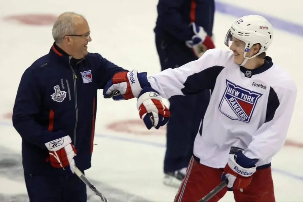 Benoit Allaire and Jesper Fast mess around during a practice session on an off day during the 2014 NHL Stanley Cup playoffs.