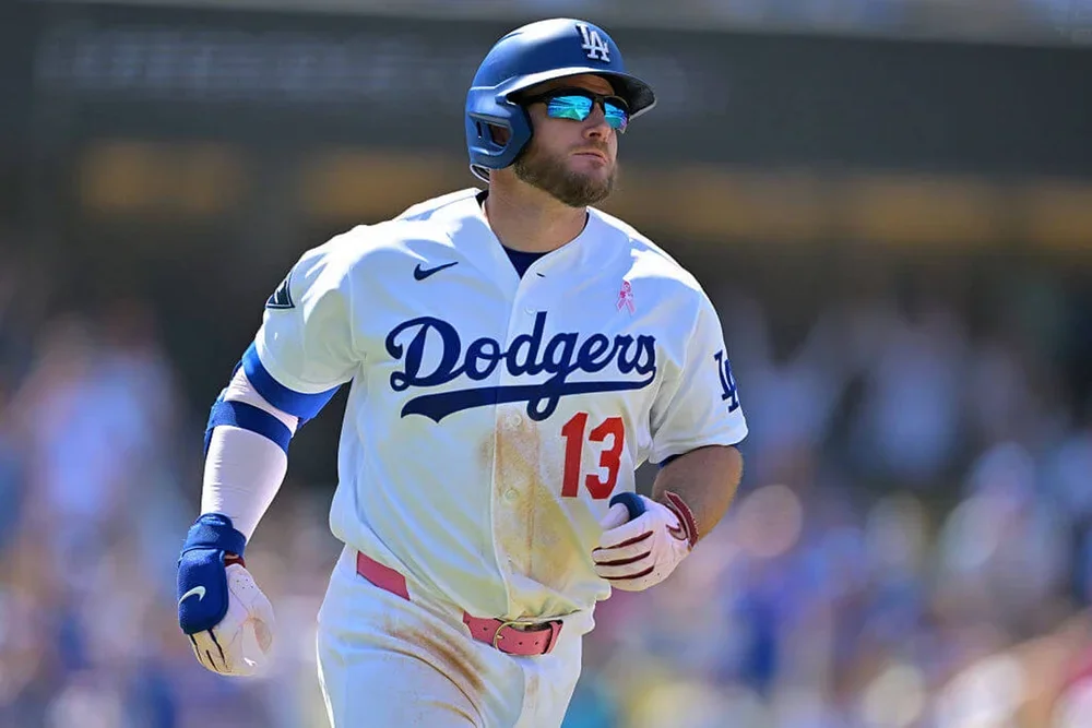 Max Muncy rounds the bases after a two-run home run in the eighth inning against the Atlanta Braves at Dodger Stadium.